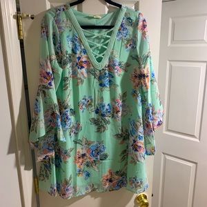 Pastel light green floral dress with flowy sleeves